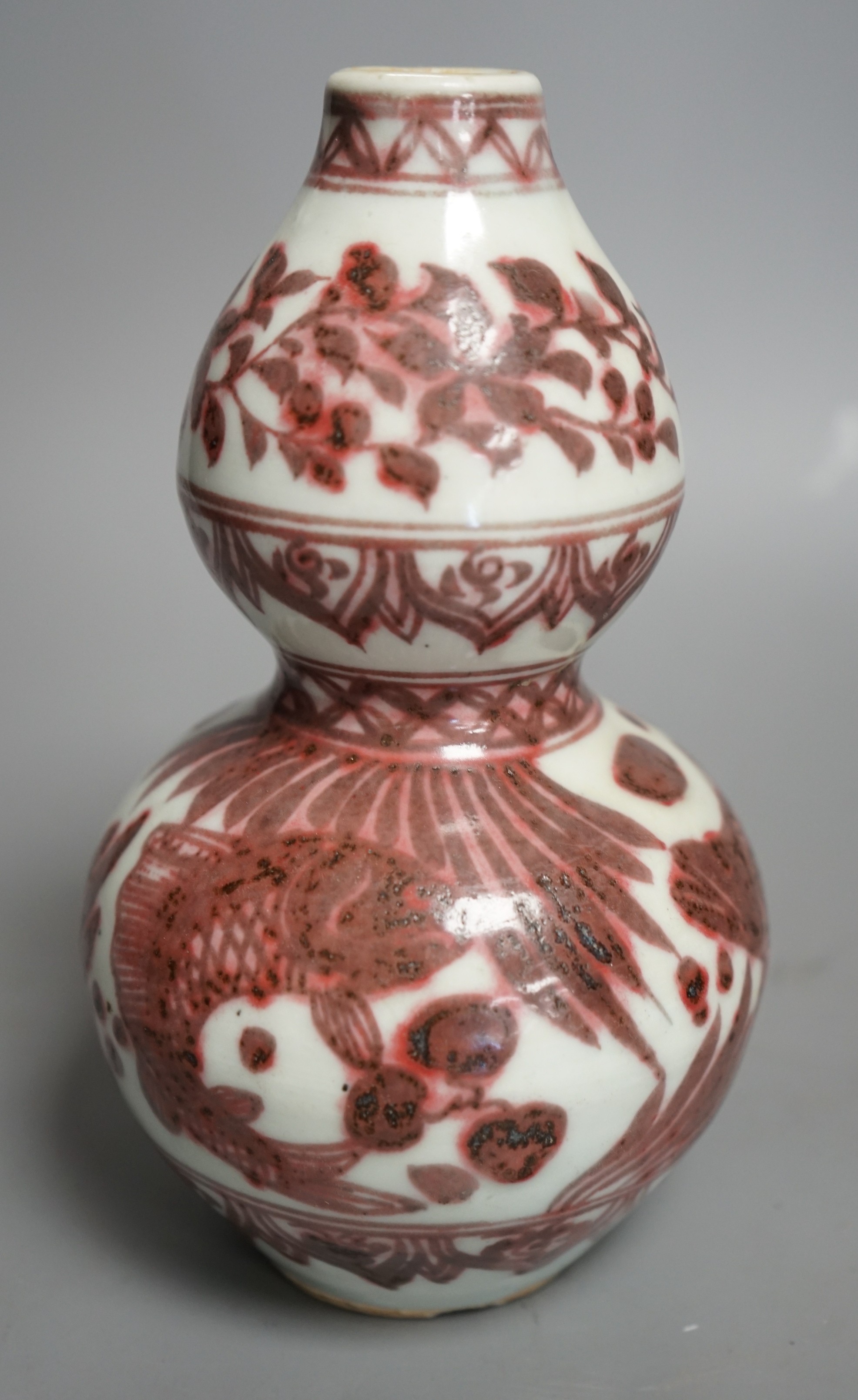 A Chinese underglaze copper red double gourd vase, 20cms high